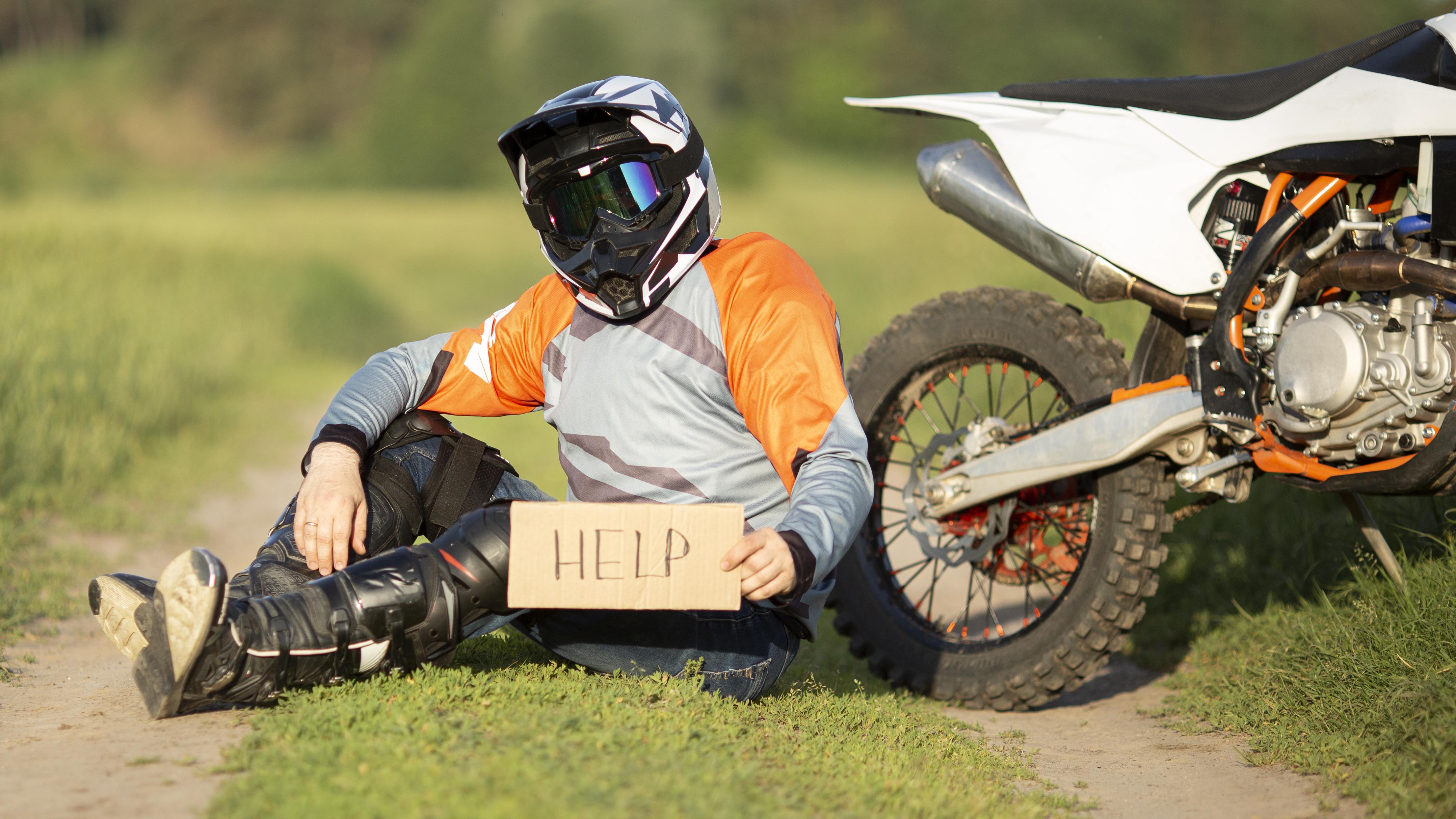 Motorcycle on the road with a rider wearing protective gear